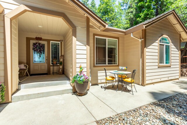 7256 Shasta Forest Dr, Shingletown, CA 96088 - doorway to property featuring a patio