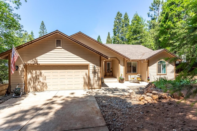 7256 Shasta Forest Dr, Shingletown, CA 96088 - ranch-style home featuring a garage, concrete driveway, and roof with shingles