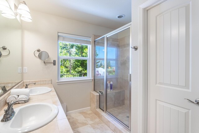 7256 Shasta Forest Dr, Shingletown, CA 96088 - bathroom with a stall shower, double vanity, baseboards, and tile patterned flooring