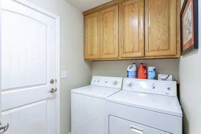 7256 Shasta Forest Dr, Shingletown, CA 96088 - washroom featuring washing machine and clothes dryer and cabinet space