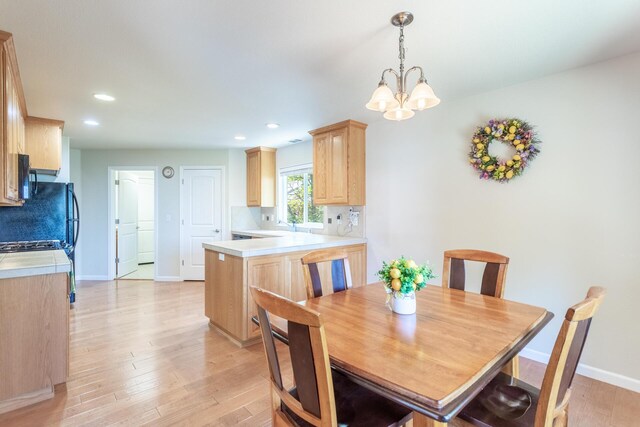 7256 Shasta Forest Dr, Shingletown, CA 96088 - dining space featuring baseboards, light wood-style floors, recessed lighting, and a chandelier
