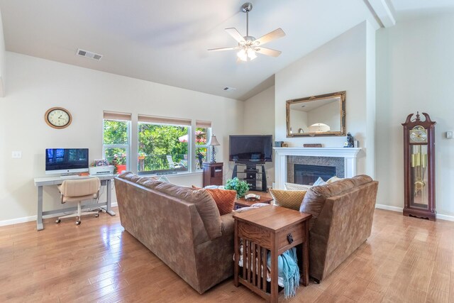 7256 Shasta Forest Dr, Shingletown, CA 96088 - living area with a glass covered fireplace, light wood finished floors, ceiling fan, baseboards, and high vaulted ceiling
