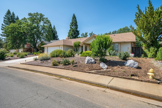 2169 Hope Ln, Redding, CA 96003 - view of front of house with a garage and concrete driveway