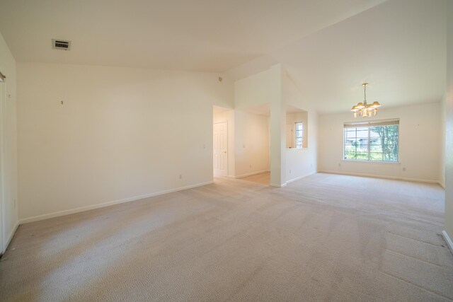 2169 Hope Ln, Redding, CA 96003 - empty room featuring a chandelier, light colored carpet, baseboards, and lofted ceiling