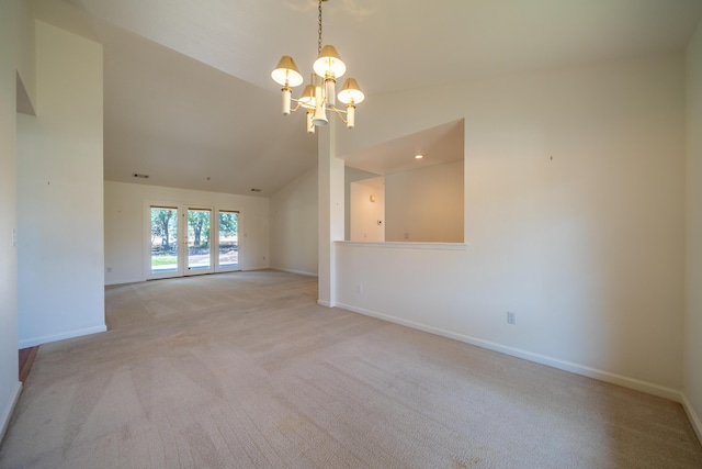 2169 Hope Ln, Redding, CA 96003 - empty room featuring a chandelier, light colored carpet, baseboards, and vaulted ceiling