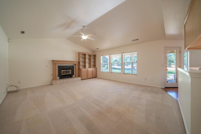 2169 Hope Ln, Redding, CA 96003 - unfurnished living room with a ceiling fan, light colored carpet, baseboards, a fireplace, and vaulted ceiling