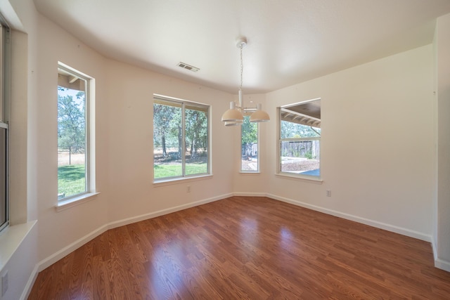 2169 Hope Ln, Redding, CA 96003 - spare room featuring plenty of natural light, wood finished floors, and baseboards