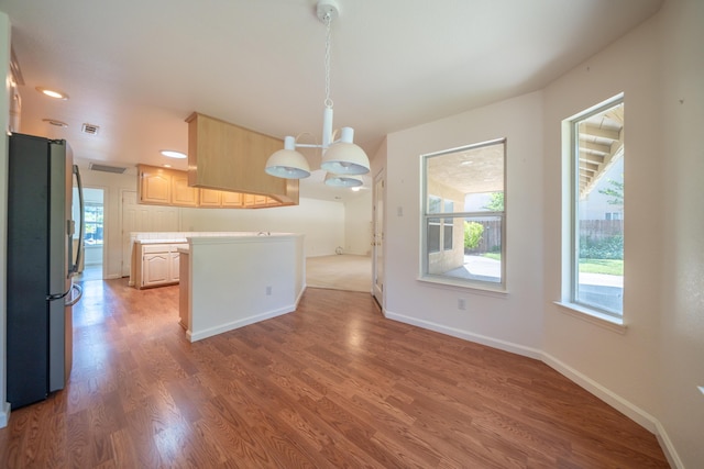 2169 Hope Ln, Redding, CA 96003 - kitchen with freestanding refrigerator, light brown cabinetry, healthy amount of natural light, light countertops, and recessed lighting