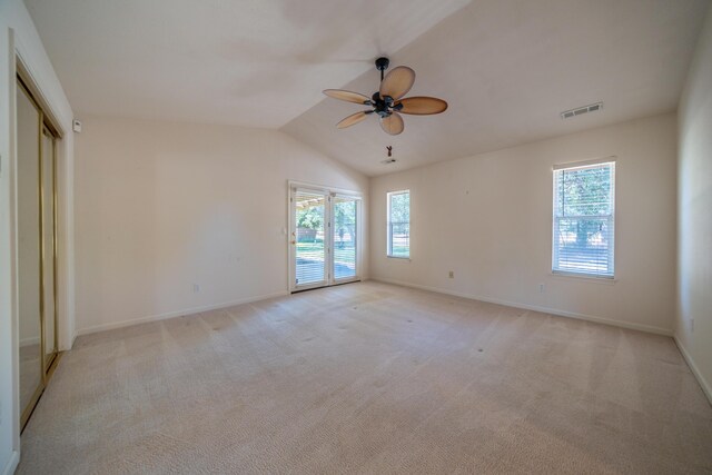 2169 Hope Ln, Redding, CA 96003 - unfurnished room with plenty of natural light, ceiling fan, baseboards, and lofted ceiling