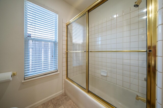 2169 Hope Ln, Redding, CA 96003 - bathroom featuring shower / bath combination with glass door, baseboards, and tile patterned floors