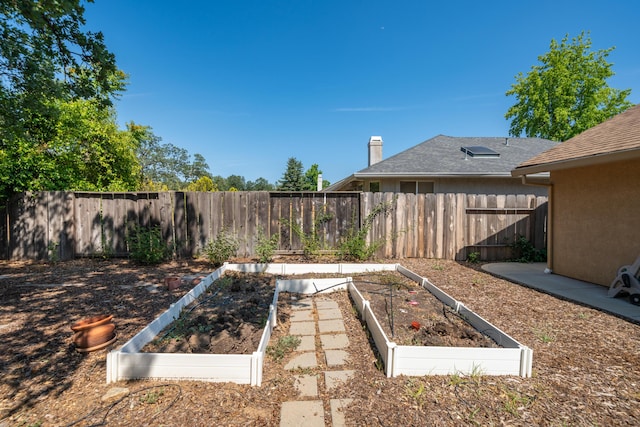 2169 Hope Ln, Redding, CA 96003 - fenced backyard featuring a garden
