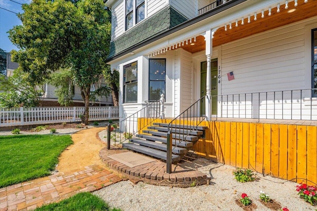 1764 Chestnut St, Redding, CA 96001 - doorway to property featuring covered porch and a shingled roof
