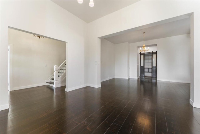 1764 Chestnut St, Redding, CA 96001 - spare room with a chandelier, stairway, and wood-type flooring
