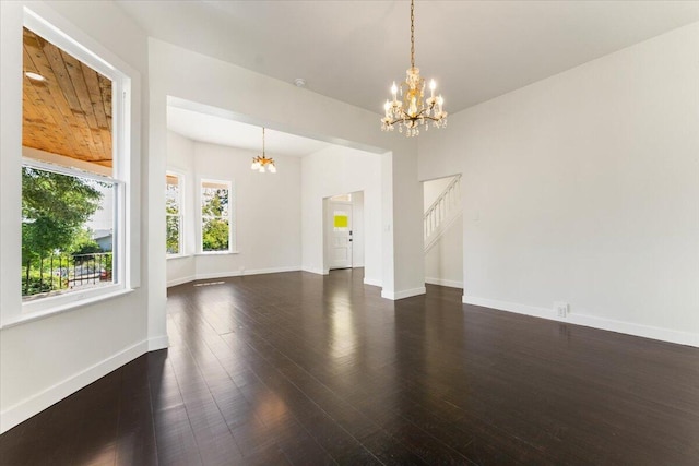 1764 Chestnut St, Redding, CA 96001 - unfurnished living room with a chandelier and dark wood finished floors