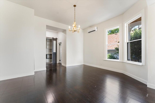 1764 Chestnut St, Redding, CA 96001 - empty room featuring a barn door, an AC wall unit, a chandelier, and wood-type flooring