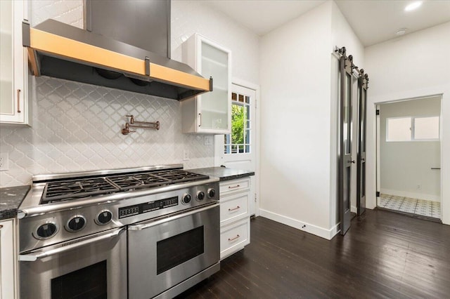 1764 Chestnut St, Redding, CA 96001 - kitchen with double oven range, wall chimney range hood, dark wood finished floors, and white cabinets