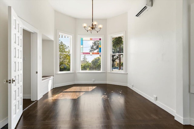 1764 Chestnut St, Redding, CA 96001 - unfurnished dining area with dark wood finished floors, a chandelier, and an AC wall unit