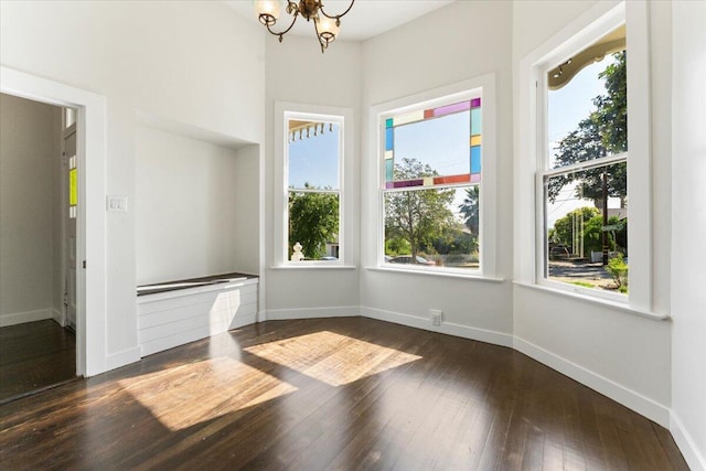 1764 Chestnut St, Redding, CA 96001 - unfurnished dining area featuring a chandelier and dark wood finished floors