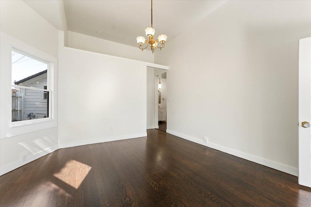 1764 Chestnut St, Redding, CA 96001 - empty room featuring a chandelier and dark wood finished floors