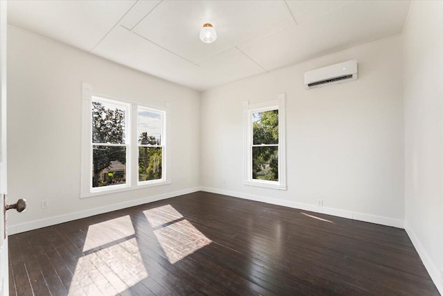1764 Chestnut St, Redding, CA 96001 - unfurnished room with an AC wall unit, plenty of natural light, and dark wood-style floors