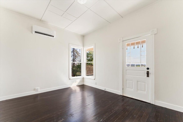 1764 Chestnut St, Redding, CA 96001 - foyer entrance featuring a wall mounted AC and dark wood finished floors