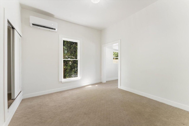 1764 Chestnut St, Redding, CA 96001 - spare room with a wall mounted air conditioner and light colored carpet