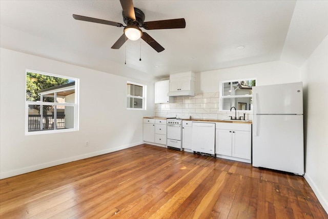 1764 Chestnut St, Redding, CA 96001 - kitchen featuring white appliances, decorative backsplash, wood-type flooring, white cabinetry, and ceiling fan