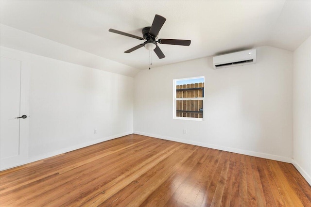 1764 Chestnut St, Redding, CA 96001 - unfurnished room with a wall mounted air conditioner, vaulted ceiling, wood finished floors, and ceiling fan