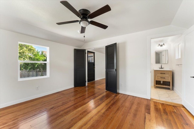 1764 Chestnut St, Redding, CA 96001 - unfurnished bedroom featuring hardwood / wood-style flooring, ensuite bathroom, and ceiling fan