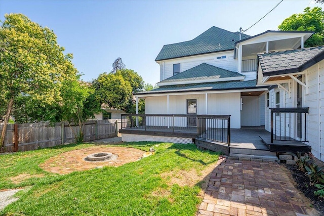 1764 Chestnut St, Redding, CA 96001 - back of property featuring a fire pit and a shingled roof
