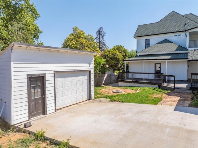 1764 Chestnut St, Redding, CA 96001 - view of front of property featuring an outdoor fire pit, an outdoor structure, and a detached garage
