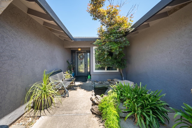 1136 Woodland Ter, Redding, CA 96002 - view of exterior entry featuring stucco siding