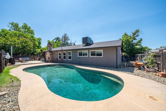 1136 Woodland Ter, Redding, CA 96002 - view of swimming pool with a patio area, a fenced backyard, and central AC