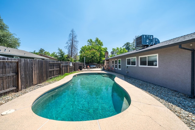 1136 Woodland Ter, Redding, CA 96002 - view of pool featuring a fenced backyard, central air condition unit, and a patio