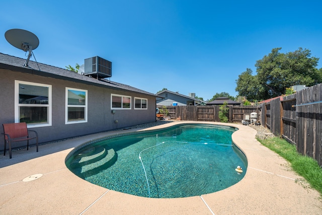 1136 Woodland Ter, Redding, CA 96002 - view of pool featuring central air condition unit and a fenced backyard