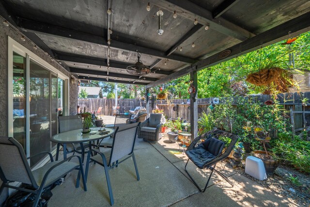 1136 Woodland Ter, Redding, CA 96002 - fenced backyard featuring a patio area and outdoor dining area