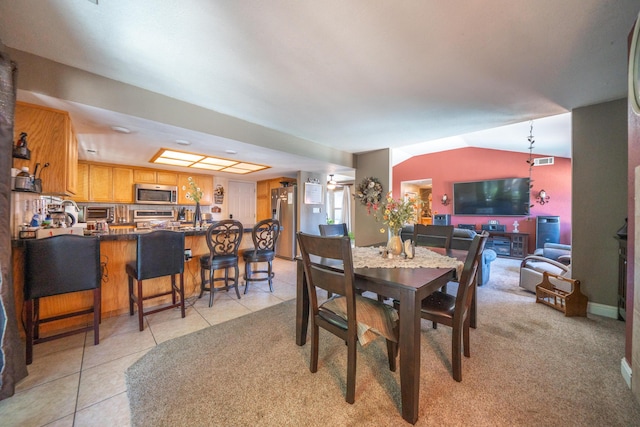1136 Woodland Ter, Redding, CA 96002 - dining area featuring light tile patterned floors and lofted ceiling