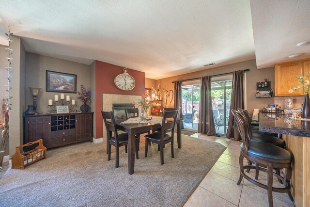 1136 Woodland Ter, Redding, CA 96002 - dining area featuring light tile patterned floors and a fireplace