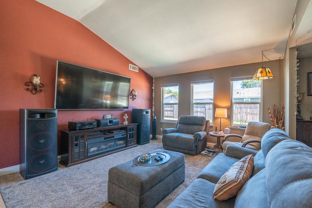 1136 Woodland Ter, Redding, CA 96002 - living area featuring vaulted ceiling, carpet flooring, and baseboards