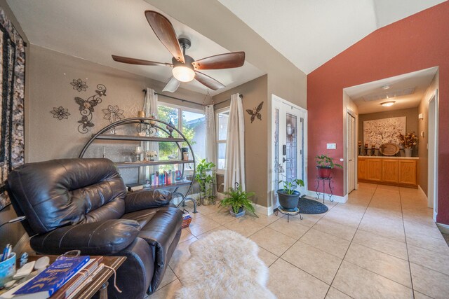 1136 Woodland Ter, Redding, CA 96002 - living area with ceiling fan, light tile patterned flooring, baseboards, and vaulted ceiling