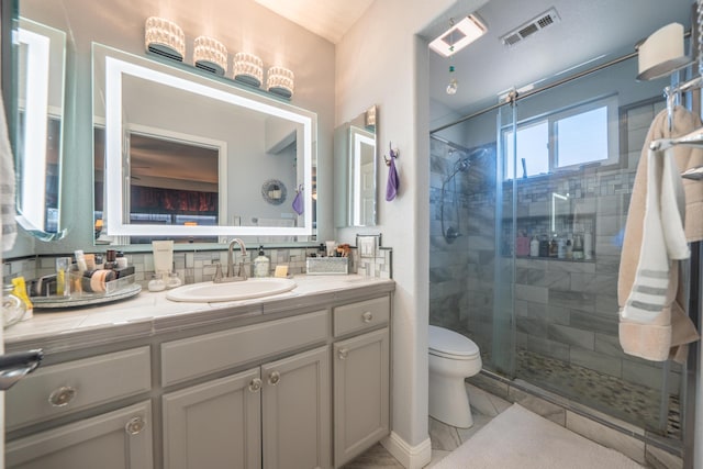 1136 Woodland Ter, Redding, CA 96002 - bathroom with vanity, toilet, and a stall shower