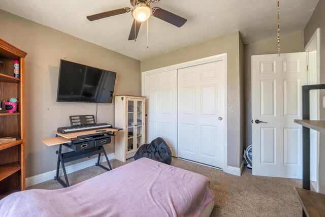 1136 Woodland Ter, Redding, CA 96002 - carpeted bedroom with a closet, baseboards, and a ceiling fan