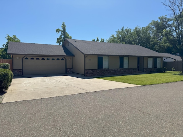 1407 Fayette Ln, Redding, CA 96003 - ranch-style home with a garage, driveway, a front lawn, and brick siding