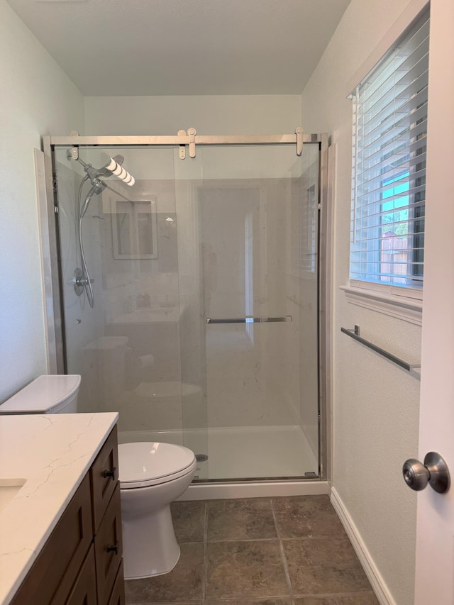 1407 Fayette Ln, Redding, CA 96003 - full bath featuring vanity, a shower stall, toilet, and tile patterned floors
