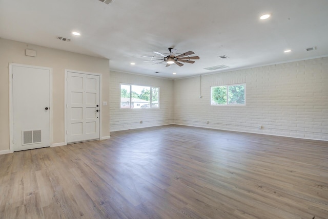 3090 Inez St, Redding, CA 96002 - unfurnished room featuring brick wall, ceiling fan, wood finished floors, baseboards, and recessed lighting