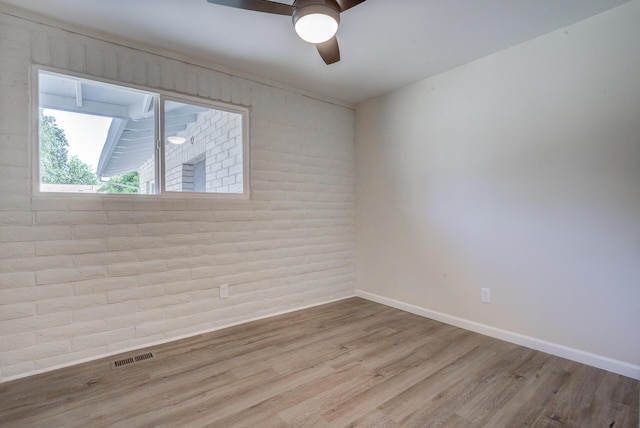 3090 Inez St, Redding, CA 96002 - empty room featuring wood finished floors, ceiling fan, and baseboards