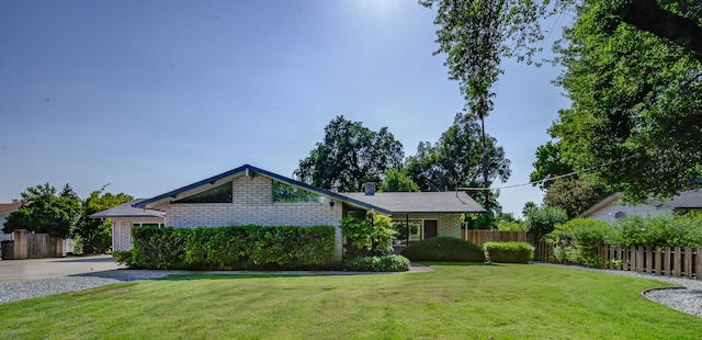 3090 Inez St, Redding, CA 96002 - view of front facade featuring brick siding and a chimney