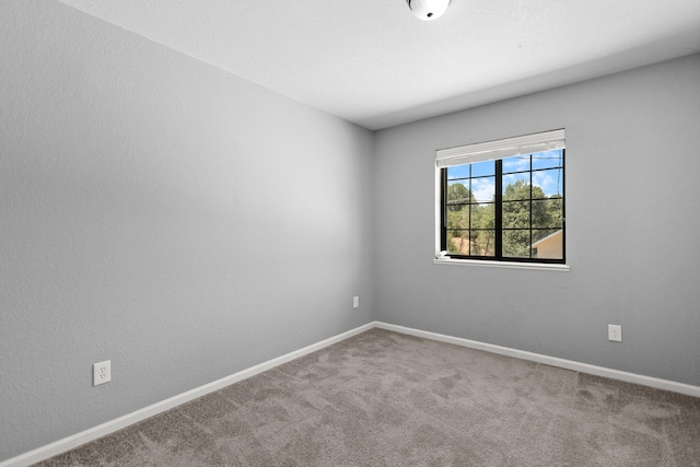 2420 Ostling Ave, Shasta Lake, CA 96019 - spare room with baseboards and carpet flooring