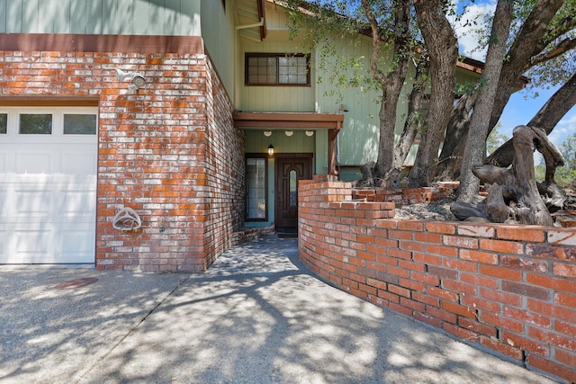 2420 Ostling Ave, Shasta Lake, CA 96019 - property entrance featuring brick siding and an attached garage
