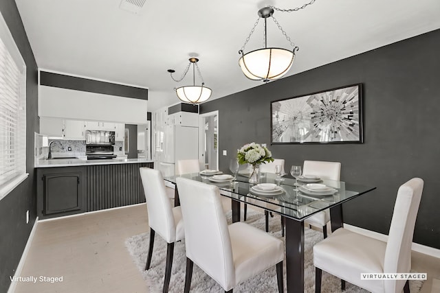 2420 Ostling Ave, Shasta Lake, CA 96019 - dining space with light wood finished floors and baseboards
